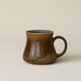 Hand-thrown ceramic mug by Rookwood Pottery