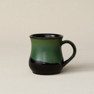 Hand-thrown ceramic mug by Rookwood Pottery