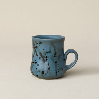 Hand-thrown ceramic mug by Rookwood Pottery