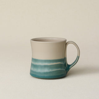 Hand-thrown ceramic mug by Rookwood Pottery