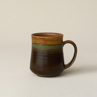 Hand-thrown ceramic mug by Rookwood Pottery