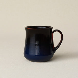 Hand-thrown ceramic mug by Rookwood Pottery