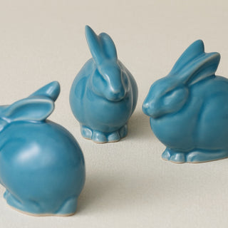 Three small ceramic bunny rabbit figurines, made in Cincinnati, OH