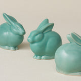 Three small ceramic bunny rabbit figurines, made in Cincinnati, OH