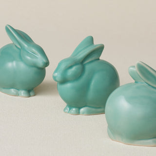 Three small ceramic bunny rabbit figurines, made in Cincinnati, OH