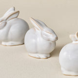 Three small ceramic bunny rabbit figurines, made in Cincinnati, OH