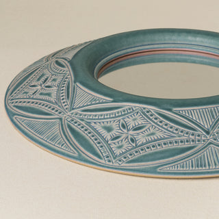 Close-up details of the one-of-a-kind mirror.