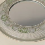 Close-up details of the one-of-a-kind mirror.