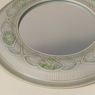 Close-up details of the one-of-a-kind mirror.