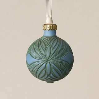 Intricately carved and glazed ceramic globe ornament with ivory satin ribbon –