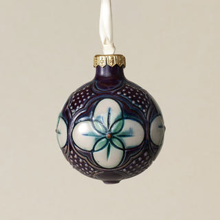 Intricately carved and glazed ceramic globe ornament with ivory satin ribbon –