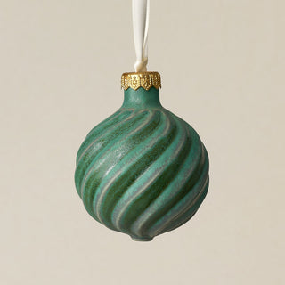 Intricately carved and glazed ceramic globe ornament with ivory satin ribbon –