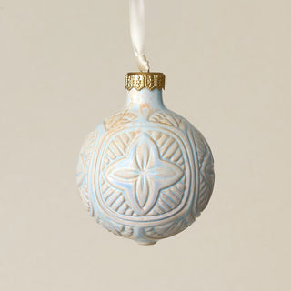 Intricately carved and glazed ceramic globe ornament with ivory satin ribbon –