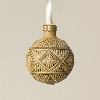 Intricately carved and glazed ceramic globe ornament with ivory satin ribbon –