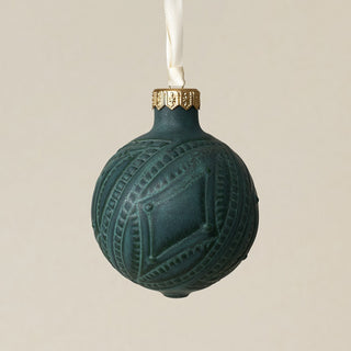 Intricately carved and glazed ceramic globe ornament with ivory satin ribbon –