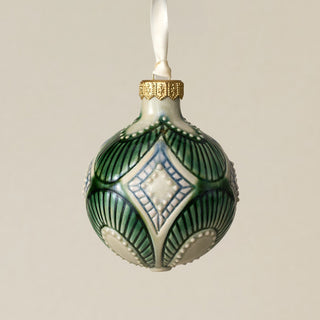 Intricately carved and glazed ceramic globe ornament with ivory satin ribbon –