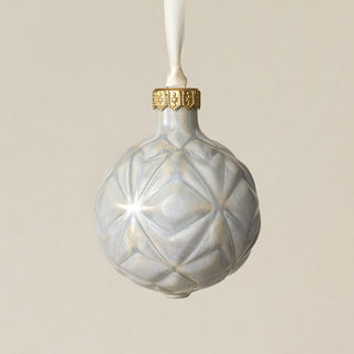 Intricately carved and glazed ceramic globe ornament with ivory satin ribbon –