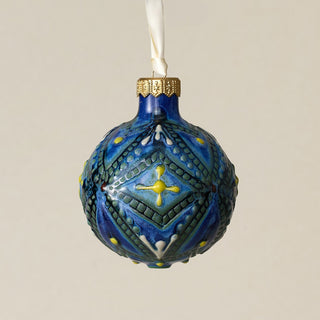 Intricately carved and glazed ceramic globe ornament with ivory satin ribbon –