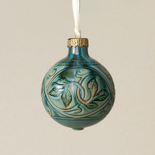 Intricately carved and glazed ceramic globe ornament with ivory satin ribbon –