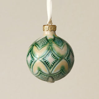 Intricately carved and glazed ceramic globe ornament with ivory satin ribbon –