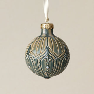 Intricately carved and glazed ceramic globe ornament with ivory satin ribbon –