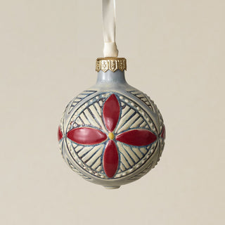Intricately carved and glazed ceramic globe ornament with ivory satin ribbon –