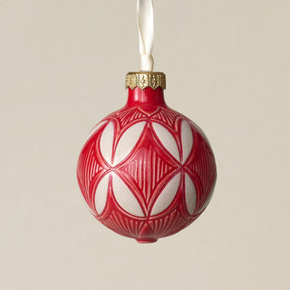 Intricately carved and glazed ceramic globe ornament with ivory satin ribbon –