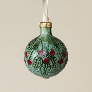 Intricately carved and glazed ceramic globe ornament with ivory satin ribbon –
