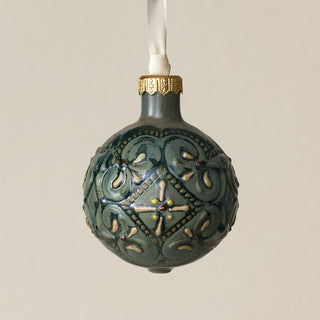 Intricately carved and glazed ceramic globe ornament with ivory satin ribbon –