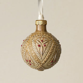 Intricately carved and glazed ceramic globe ornament with ivory satin ribbon –