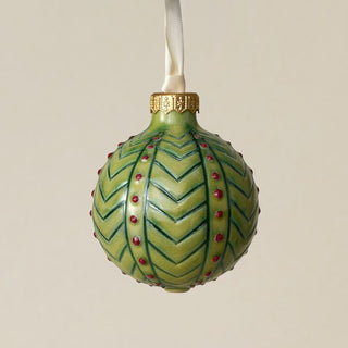 Intricately carved and glazed ceramic globe ornament with ivory satin ribbon –