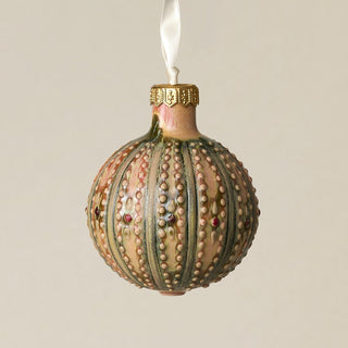 Intricately carved and glazed ceramic globe ornament with ivory satin ribbon –