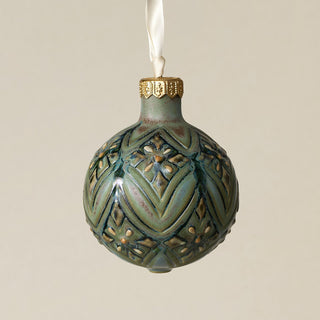 Intricately carved and glazed ceramic globe ornament with ivory satin ribbon –
