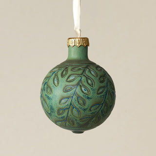 Intricately carved and glazed ceramic globe ornament with ivory satin ribbon –