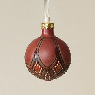 Intricately carved and glazed ceramic globe ornament with ivory satin ribbon –