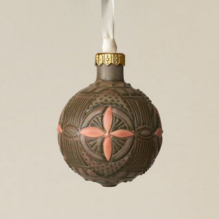 Intricately carved and glazed ceramic globe ornament with ivory satin ribbon –