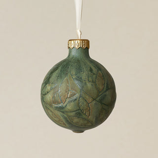 Intricately carved and glazed ceramic globe ornament with ivory satin ribbon –