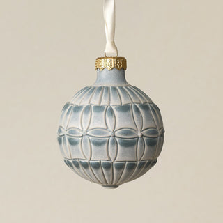 Intricately carved and glazed ceramic globe ornament with ivory satin ribbon –