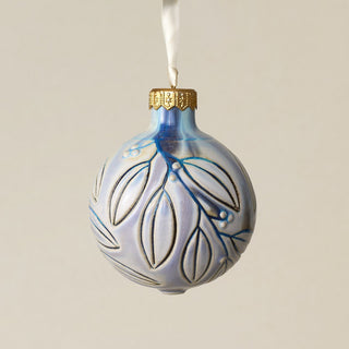 Intricately carved and glazed ceramic globe ornament with ivory satin ribbon –