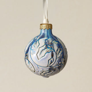 Intricately carved and glazed ceramic globe ornament with ivory satin ribbon –