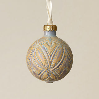 Intricately carved and glazed ceramic globe ornament with ivory satin ribbon –