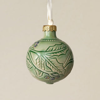 Intricately carved and glazed ceramic globe ornament with ivory satin ribbon –