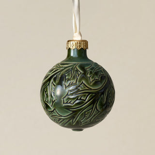 Intricately carved and glazed ceramic globe ornament with ivory satin ribbon –