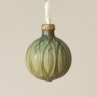 Intricately carved and glazed ceramic globe ornament with ivory satin ribbon –
