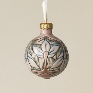 Intricately carved and glazed ceramic globe ornament with ivory satin ribbon –