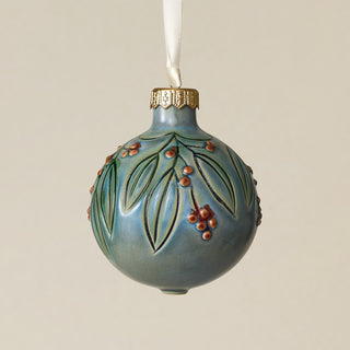 Intricately carved and glazed ceramic globe ornament with ivory satin ribbon –