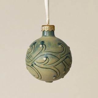 Intricately carved and glazed ceramic globe ornament with ivory satin ribbon –