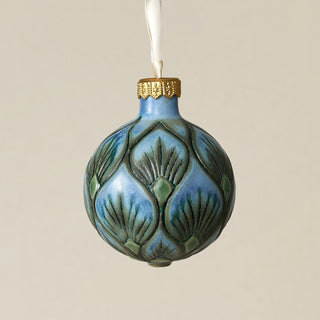 Intricately carved and glazed ceramic globe ornament with ivory satin ribbon –