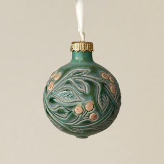 Intricately carved and glazed ceramic globe ornament with ivory satin ribbon –