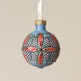 Intricately carved and glazed ceramic globe ornament with ivory satin ribbon –